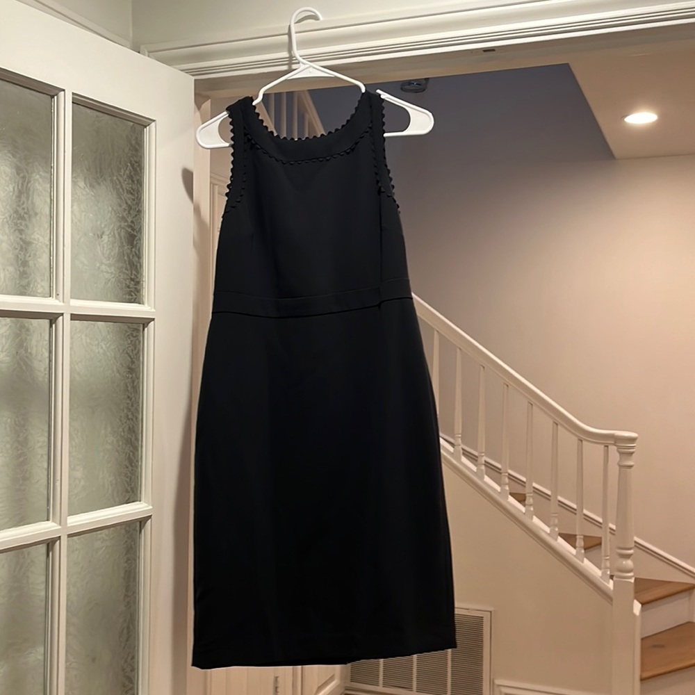 Navy blue fitted midi work dress with scalloped deck lien and banded waist